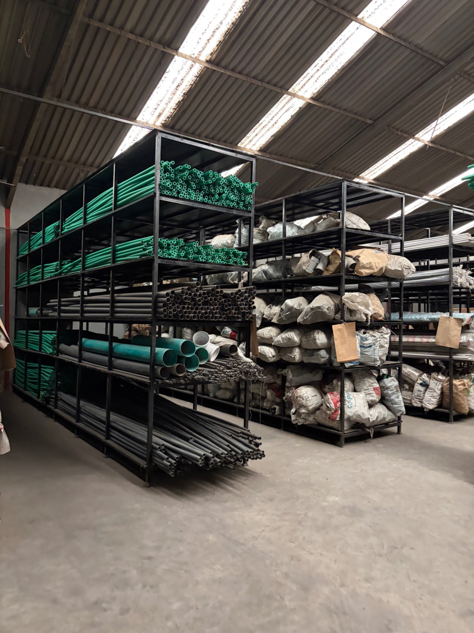 PPR pipes arranged on warehouse storage racks, photograph 2